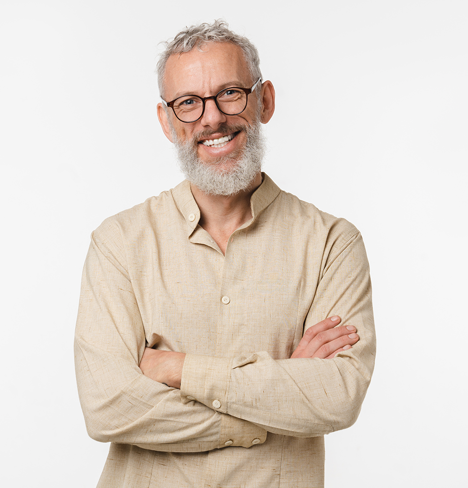 mid-aged man smiling with arms crossed